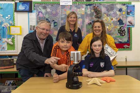 Brittas Bay Mixed National School, Co. Wicklow, celebrate being national winners of the Explorers Ocean Champions Award as part of their World Ocean Day art exhibition! Pictured with students showing their STEAM project: Marine Institute Director Joe Silke, Explorers Outreach officer Mona McCrea, and artist Jane Groves recognising their vital project: "Why Keeping the Ocean Healthy Matters in Education.”