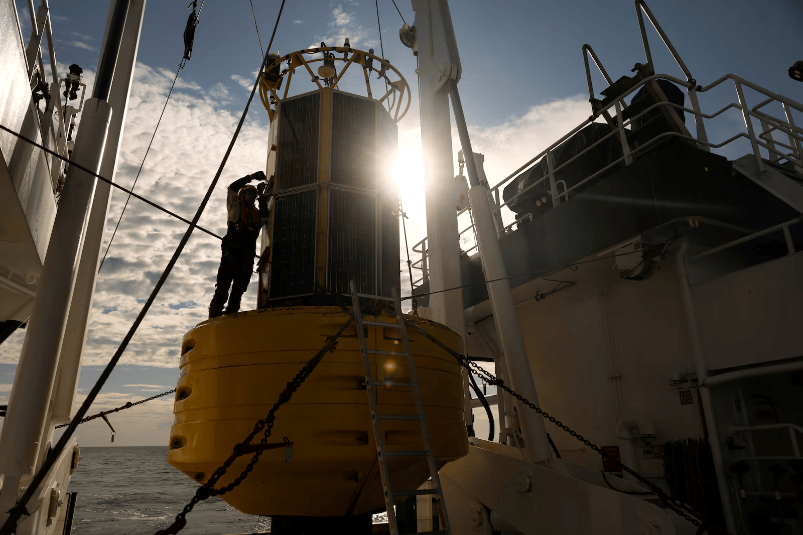 Donal Kennedy, senior marine offshore services technician with P&O Maritime Logistics, inspects the recovered M5 weather buoy on the RV Tom Crean.