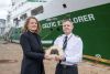 Caroilín Callery of the National Famine Way handing over the Bronze Shoes to Captain Denis Rowan, RV Celtic Explorer. Picture credit XPOSURE