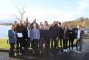 A groupd of employees at the bank of lake Furnace